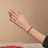 Seedrache | Emaillierter Lotus | Blaugrünes Glühwürmchen-Glasschlangenarmband